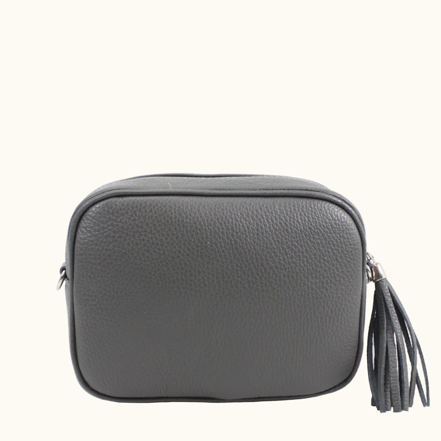 Gray leather crossbody bag with a tassel on a white background