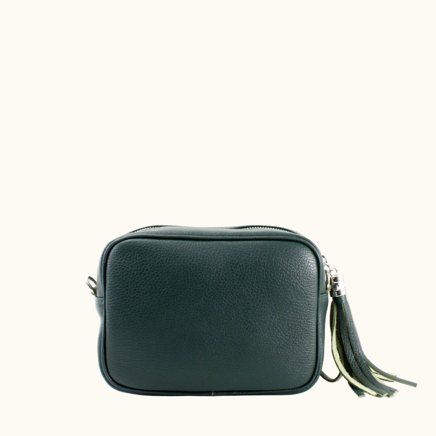Green leather crossbody bag with a tassel on a white background