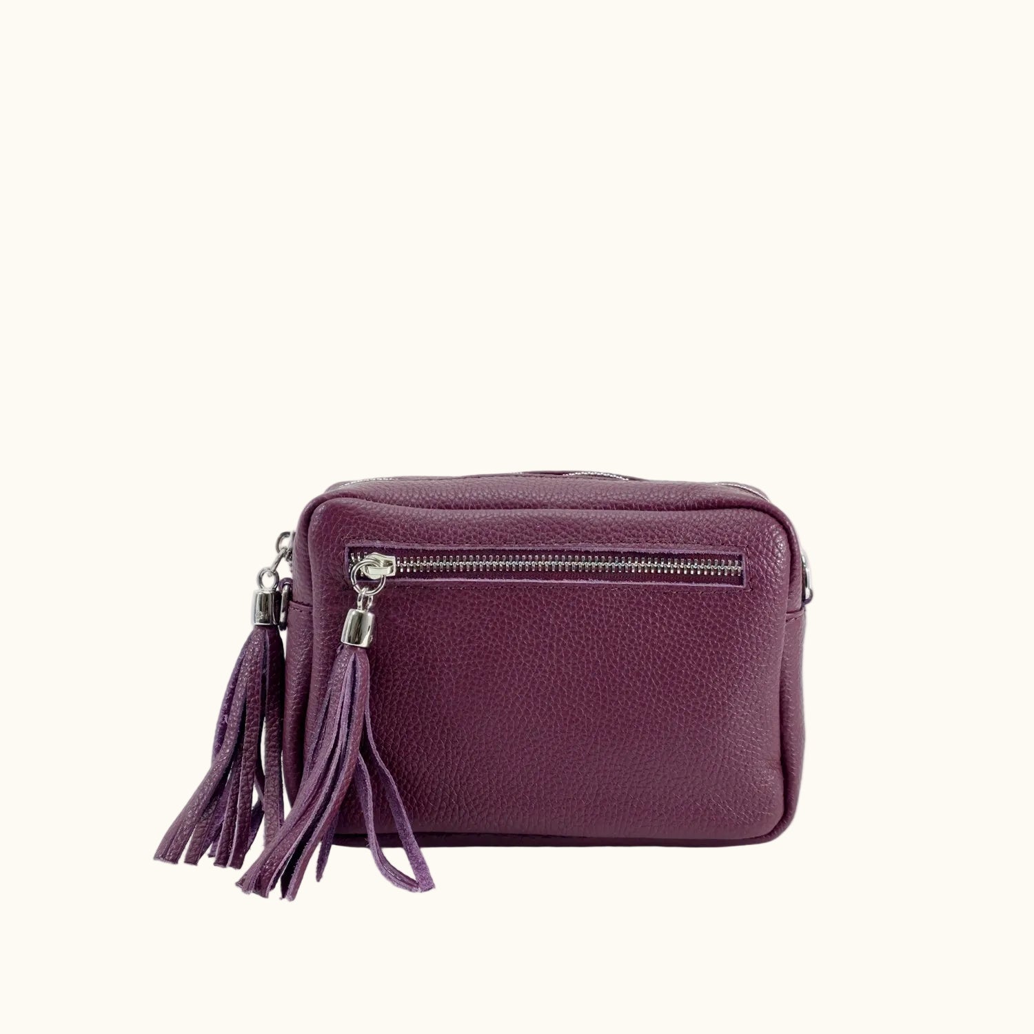 Purple handbag with a tassel on a white background