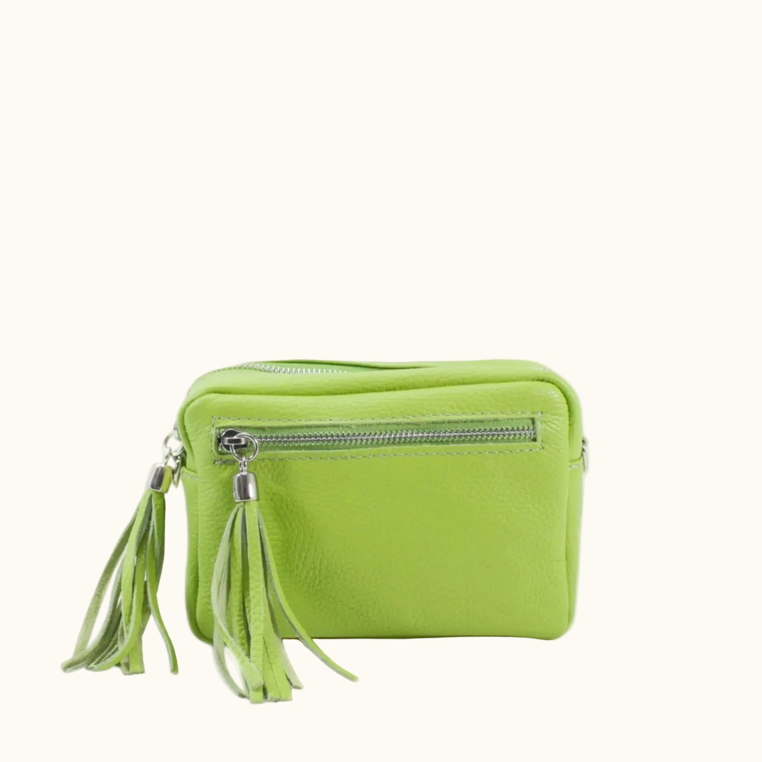 Green handbag with tassels on a white background
